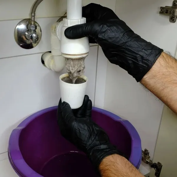 Expert drain cleaning under a kitchen sink in Chatham-Kent